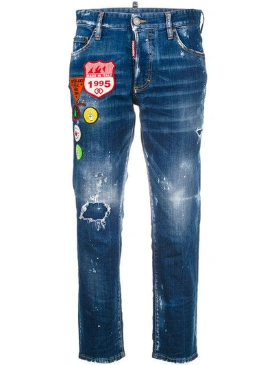 Shop Dsquared2 Cropped Distressed Jeans With Patches - Blue