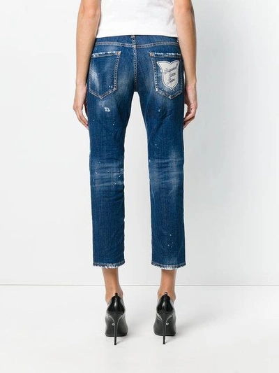 Shop Dsquared2 Cropped Distressed Jeans With Patches - Blue