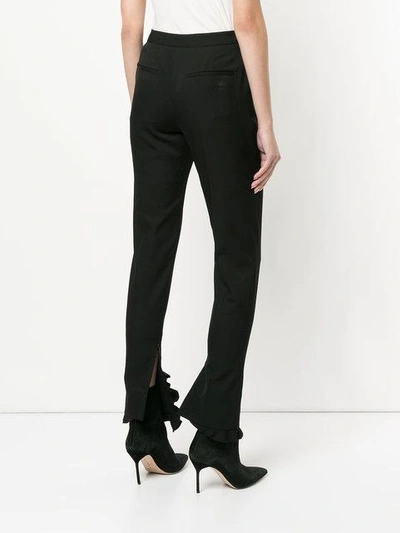Shop Irene Frilled Hem Trousers In Black
