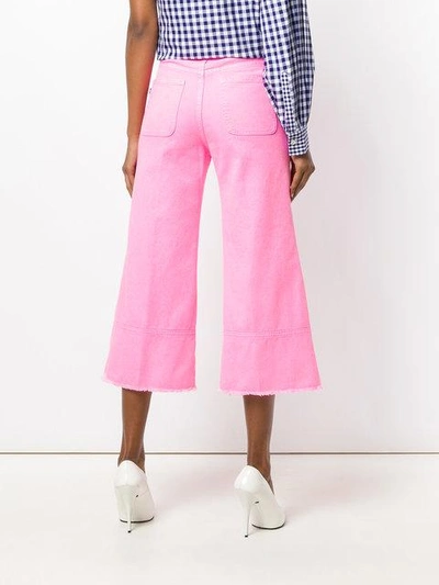 Shop Msgm Cropped Flare Jeans - Pink