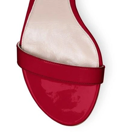 Shop Stuart Weitzman The Simple Sandal In Flame Red Patent