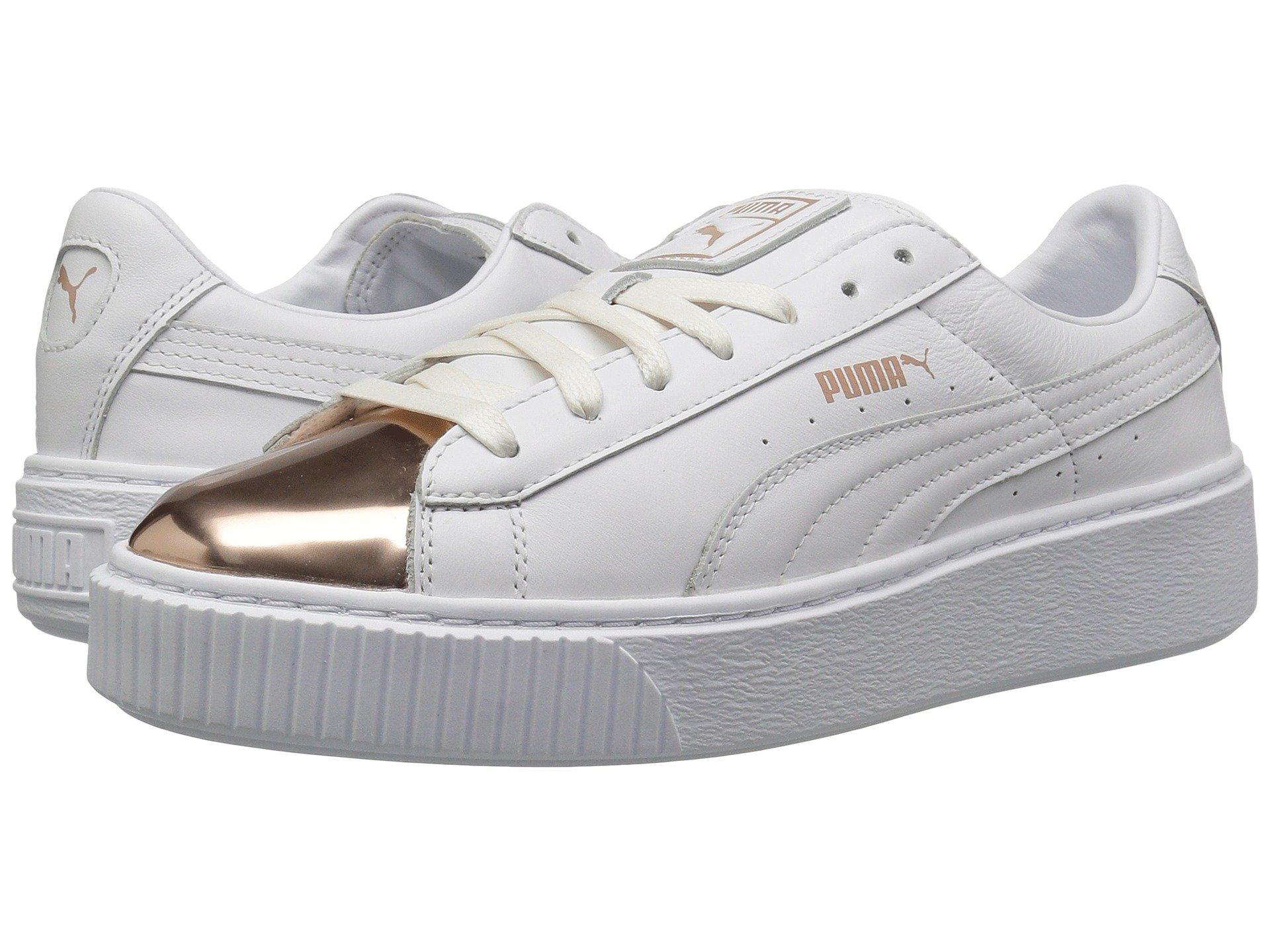 white and rose gold pumas