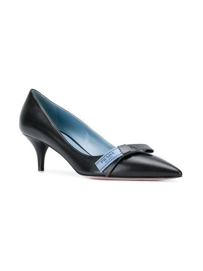 Shop Prada Logo Bow Embellished Pumps In Black