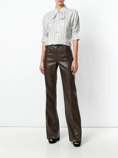 Shop Prada Flared Leather Trousers - Brown