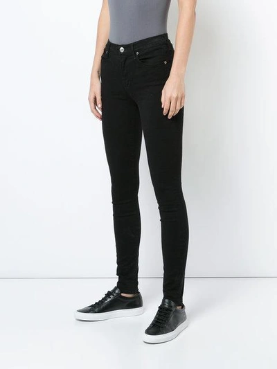 Shop Agolde 'sophie' Skinny-jeans In Jet