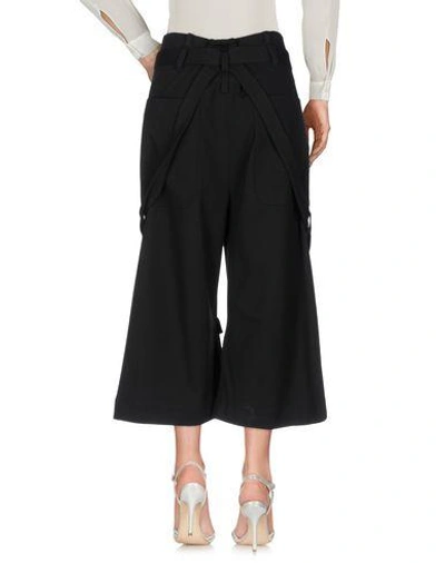 Shop Marcelo Burlon County Of Milan Cropped Pants & Culottes In Black