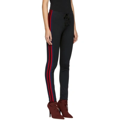 Shop Yeezy Black Striped Football Leggings In Ink/ruby/luna