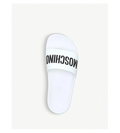 Shop Moschino Logo Rubber Pool Sliders In White/blk