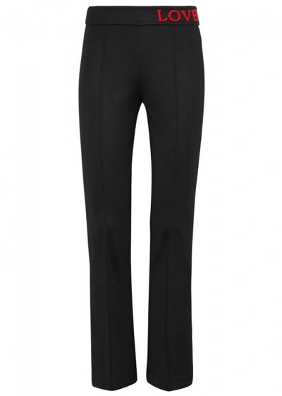 Shop Gucci Love-embroidered Jersey Trousers In Black