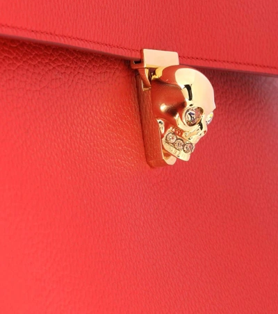 Shop Alexander Mcqueen Skull Leather Clutch In Red