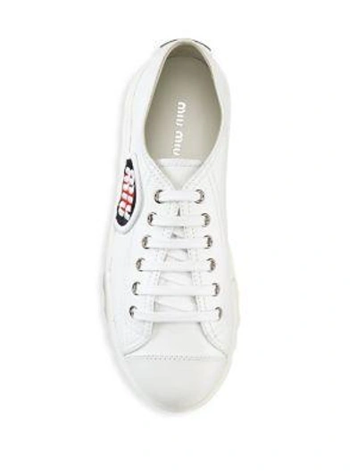 Shop Miu Miu Patch Leather Sneakers In White