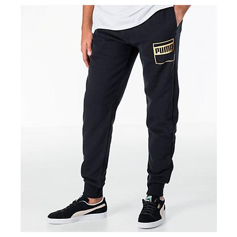 black and gold puma pants