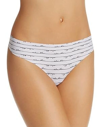 Shop Calvin Klein Invisibles Thong In Scripted Logo