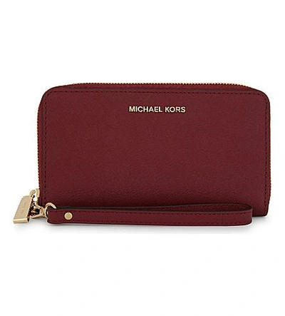 Shop Michael Michael Kors Jet Set Travel Large Leather Phone Wallet In Mulberry
