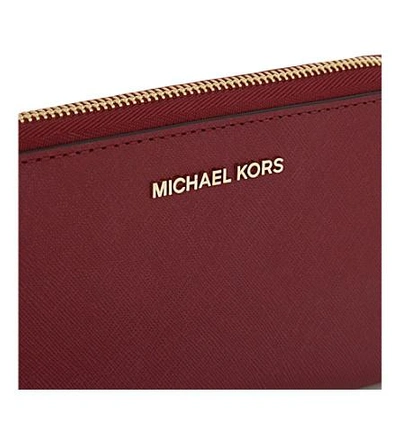 Shop Michael Michael Kors Jet Set Travel Large Leather Phone Wallet In Mulberry