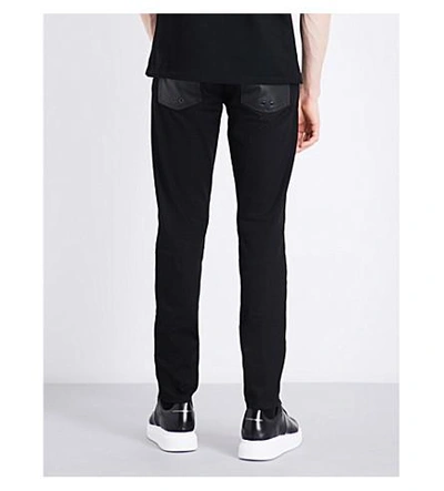 Shop Alexander Mcqueen Zipped-cuffs Slim-fit Tapered Jeans In Black Black