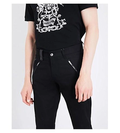 Shop Alexander Mcqueen Zipped-cuffs Slim-fit Tapered Jeans In Black Black
