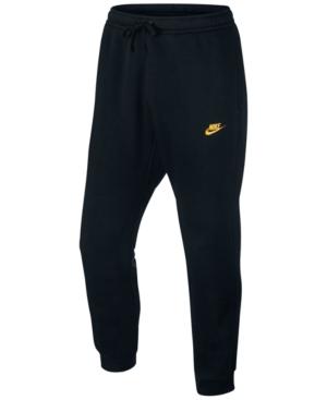 black and gold nike track pants