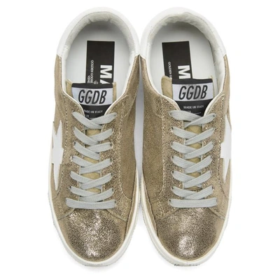 Shop Golden Goose Gold May Sneakers In Gold Crack-