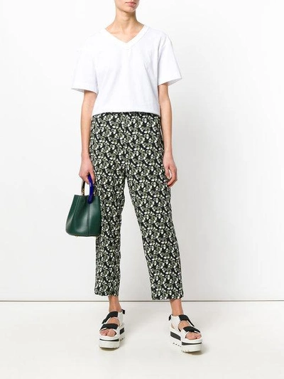 Shop Marni Floral Printed Trousers In Black