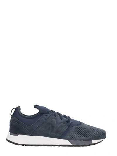 Shop New Balance 247 Blue Suede Sneakers
