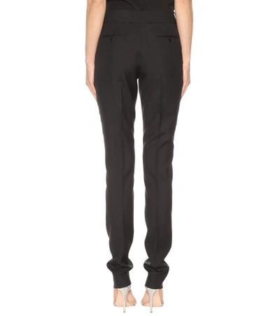 Shop Saint Laurent Wool Mid-rise Trousers In Black