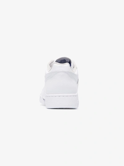 Shop Reebok Workout Plus Low-top Sneakers In White