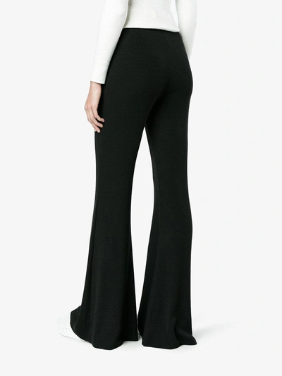 Shop Beaufille High Waisted Flared Trousers In Black