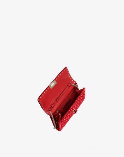 Shop Valentino Garavani Velvet Rockstud Spike Crossbody Clutch In Rosso