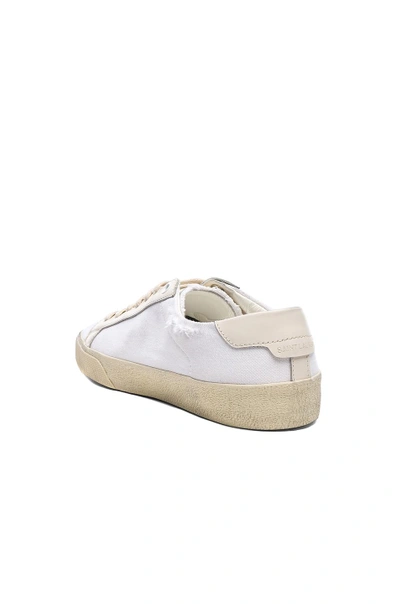 Shop Saint Laurent Embroidered Canvas Court Classic Sneakers In Cream. In Creme & Optic White