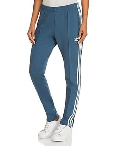 Shop Adidas Originals Slouchy Track Pants In Dark Teal