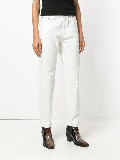 Shop Saint Laurent Tapered Leg Jeans In White