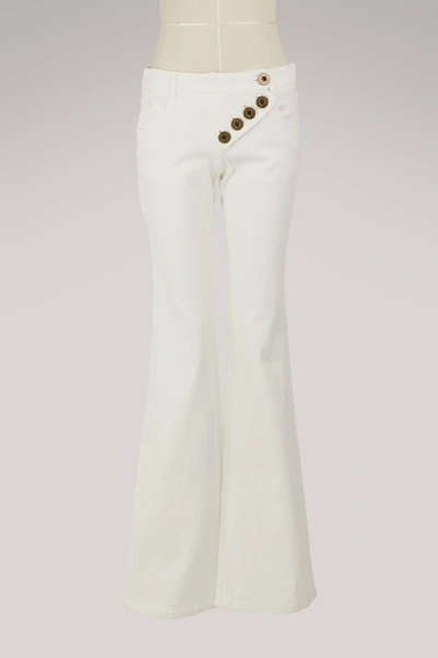 Shop Chloé Flare Jeans In White