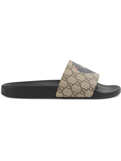 Shop Gucci Gg Supreme Slides With Wolf - Neutrals