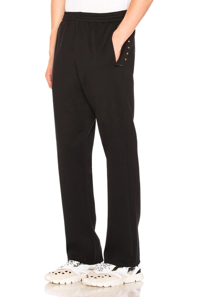 Shop Valentino Studded Track Pant In Black