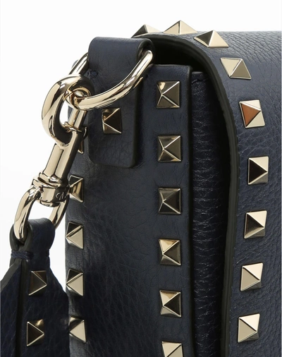 Shop Valentino Medium Grain Calfskin Leather Rockstud Crossbody Bag In Dark Blue