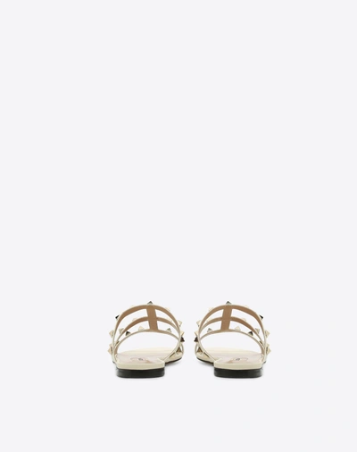 Shop Valentino Garavani Rockstud Flat Calfskin Slide Sandal In Light Ivory
