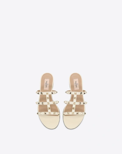 Shop Valentino Garavani Rockstud Flat Calfskin Slide Sandal In Light Ivory