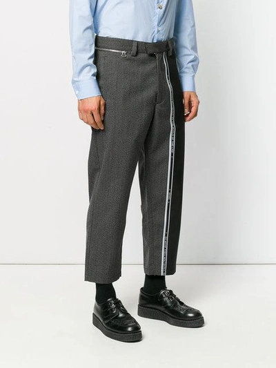 Shop Oamc Cropped Stripe Panel Trousers - Grey