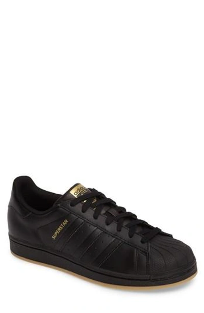 Shop Adidas Originals Superstar Sneaker In Core Black/ Gold Met/ Gum 3