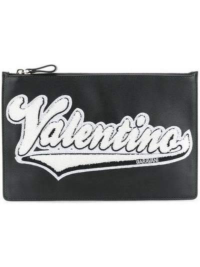 Shop Valentino Logo Appliqued Clutch In Black