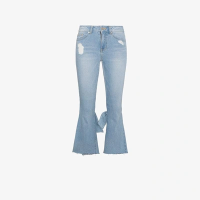 Shop Sjyp Cropped Kick Flare Jeans In Blue