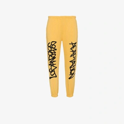 Shop Adaptation Graffiti Track Pants In Yellow&orange