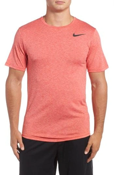 Shop Nike Hyper Dry Training Tee In Bright Melon/ Track Red