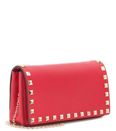 Shop Valentino Rockstud Leather Clutch In Red