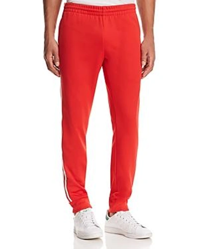 Shop Adidas Originals Superstar Track Pants In Scarlet Red