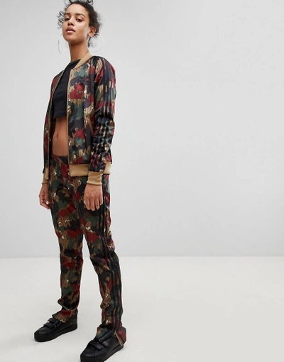 Shop Adidas Originals X Pharrell Williams Hu Camo Track Pants - Multi