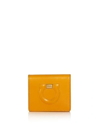 Shop Ferragamo Gancini Leather Wallet In Zinnia Yellow/gold