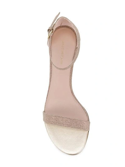 Shop Stuart Weitzman Simple Glitter Sandals - Neutrals