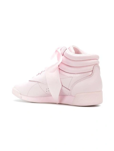 Shop Reebok Freestyle Hi Satin Bow Sneakers In Pink